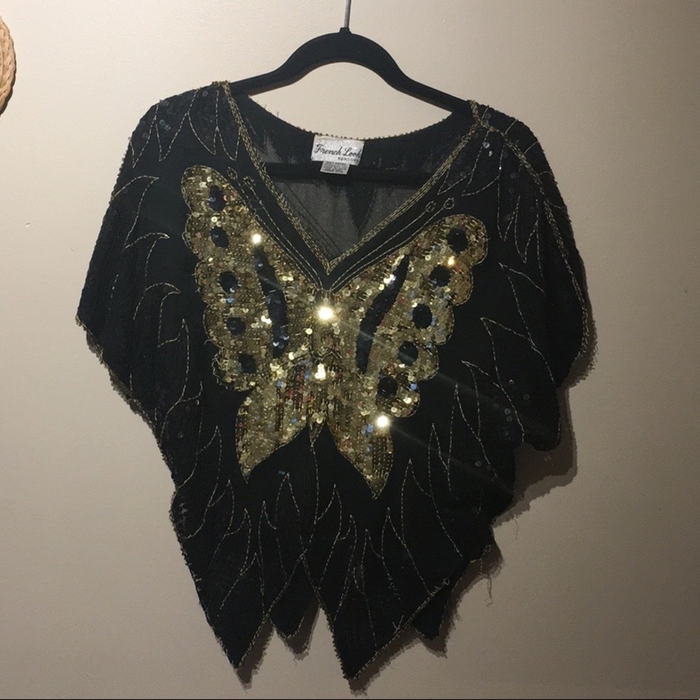 Butterfly shaped beaded French look blouse.